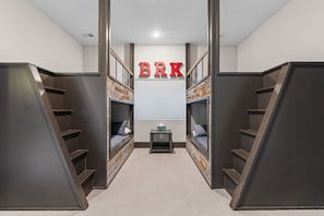 Walk-out basement bunk area. Doubles on bottom, twins on top.