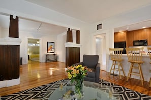 Another view of the living area into the foyer.