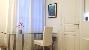 Office table and window with chair and painting