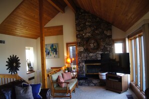 Open concept great room, but TV has since been posted to the wall.