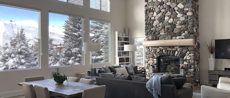 2-story picture windows of mountains in great room.