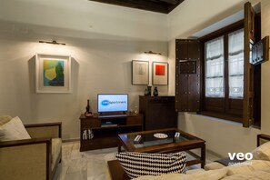 Living area with TV. There is free WIFI internet access.