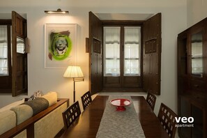 Dining area with a table and 4 chairs.
