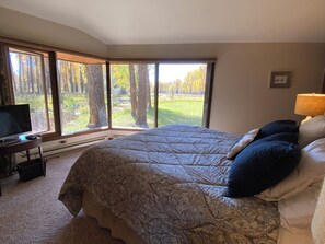 Master bedroom looks out onto private stream