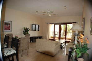 The spacious living room. There are marble floors throughout the unit!  