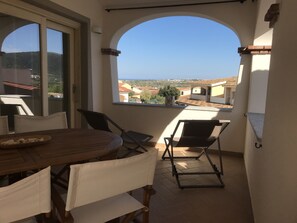 Panoramic terrace equipped with dining table and relax corner