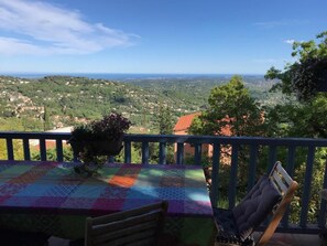 panoramic view of sea and hills from balcony