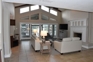 Living room with windows over looking the water