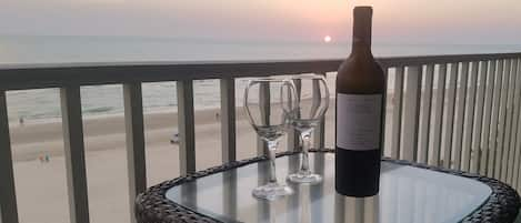 Enjoy a glass of wine on the balcony at Sunset.