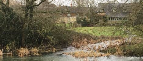 View of rear across The Thames and the orchard