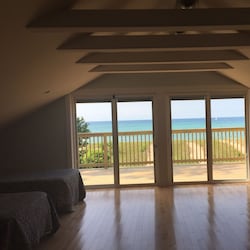 Third level bedroom view of lake and deck