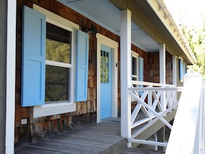 Blue shutters and cedar shakes welcome you home when you arrive at the house. 