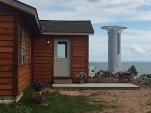 The hous overlooks the lake, and the nearly completed observation tower.