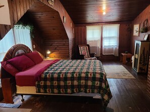 Master bedroom like no other. Roomy lakeview and all knotty pine.