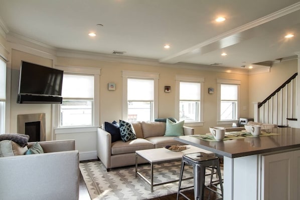 Living room and kitchen island. Open concept, great space for hanging out!