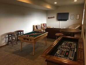 Lowest level game room: Bumper pool, Xbox 360, TV, poker table and casino table.