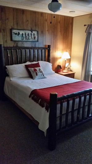 Queen size log bed in master bedroom