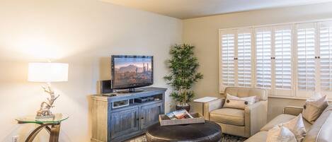 Comfortable Living Room with Cable TV and Apple TV