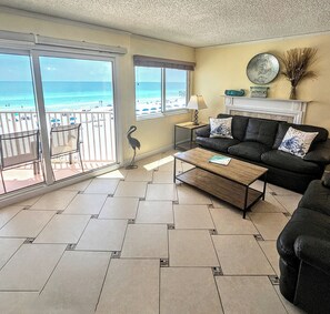 Queen memory foam pullout couch in the light, open living space.