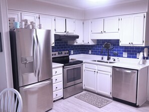 Our recently updated kitchen with stainless appliances and quartz countertops