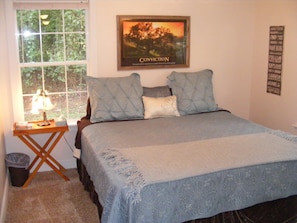 West side bedroom with a firm king size bed, 3 large windows and large closet.