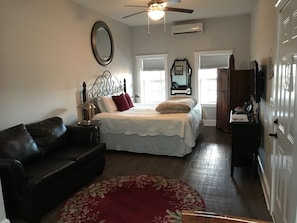Comfortable living space with leather sofa and king size bed!