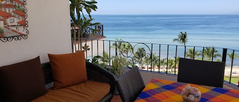 Your magnificent view from the large balcony. sounds of the beach. 