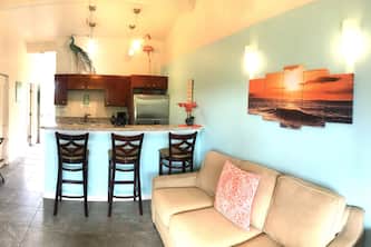 Beach access shops & dining with A/C Centrally located family friendly. End unit