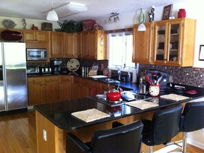 Kitchen with 3 bar stools