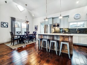 Dining space plus island seating with bar stools. 