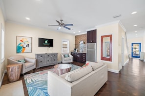1st floor living area with easy access to grill and pool.