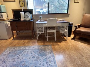 Kitchenette, desk, and recliner.