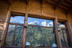 Huge living room picture window with incredible views of the mountains