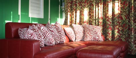 Living Room with TV, DVD and curtain separating second bedroom