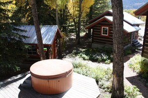 Hot tub area, small cabin to the left is our office