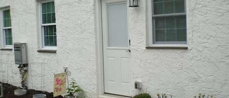 First-Floor Apartment entrance.  No stairs to climb.  Nice little garden.  
