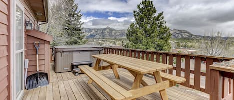 hot tub and picnic table on the large deck 