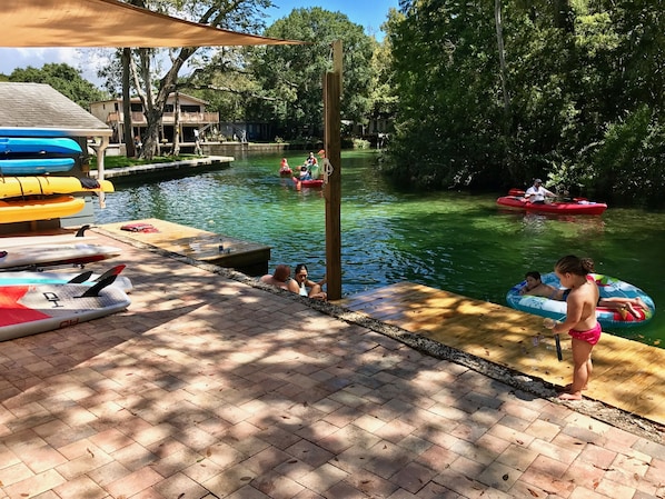 View upriver from the large paver patio with sunshade.