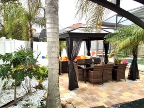 Dining and sitting area under suncover with mosquito net