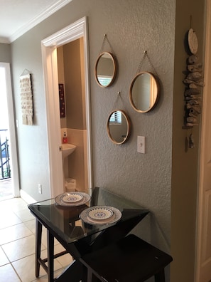 Breakfast nook is next to bathroom door.