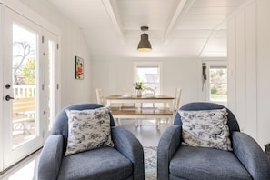 Living and dining area featuring Crate & Barrel and World Market furniture.