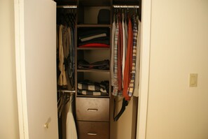This is one of three organized closets, there is also a laundry hamper.
