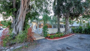 Lushly landscaped Florida Cottage with free parking for 2 cars.