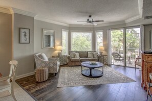 View of living room showing queen sleeper sofa.