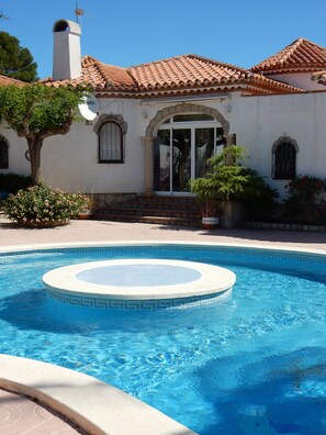 Community Pool and rear of the villa. 