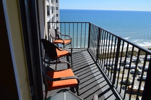 4 padded chairs & 2 sidetables to relax & enjoy the sounds & views of the ocean.