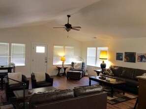 Bright and open living room segues into dining & kitchen
