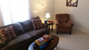 Spacious living room with games, dvd's and books.