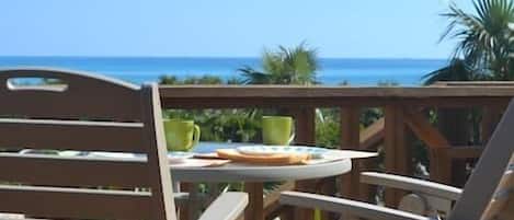 Enjoy morning coffee on the deck with a beautiful view of the ocean.