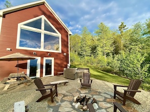 Hot tub, picnic table, fire pit, and lawn for yard games